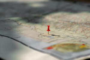 Putting pins to destination on map. Plan travel and relax with vacation holiday.