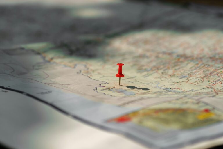 Putting pins to destination on map. Plan travel and relax with vacation holiday.